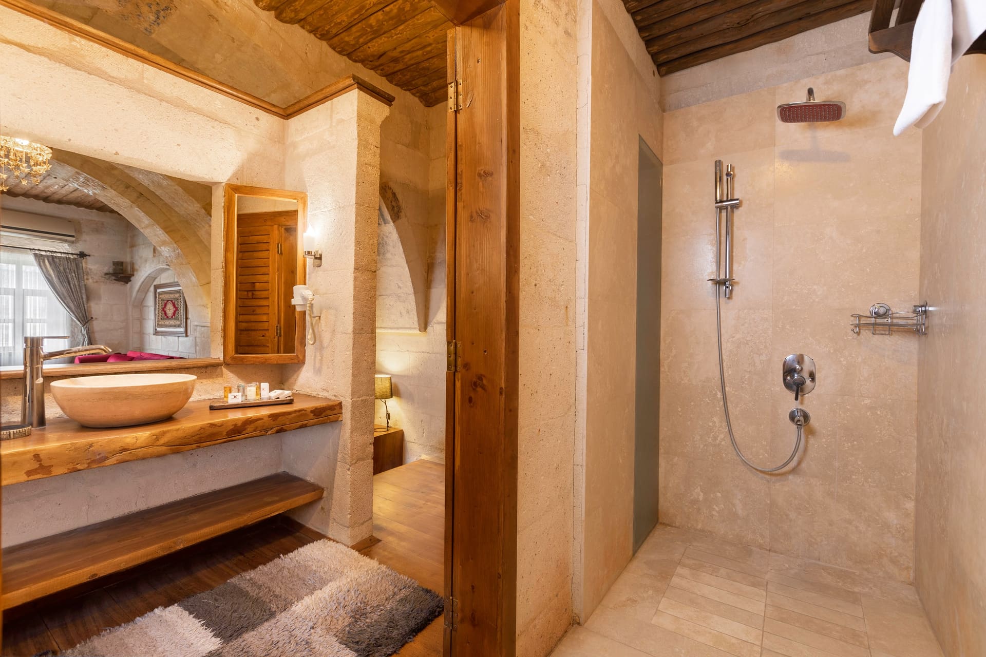Room 108, Junior Suite: Open walk-in shower, stone walls, rain showerhead.