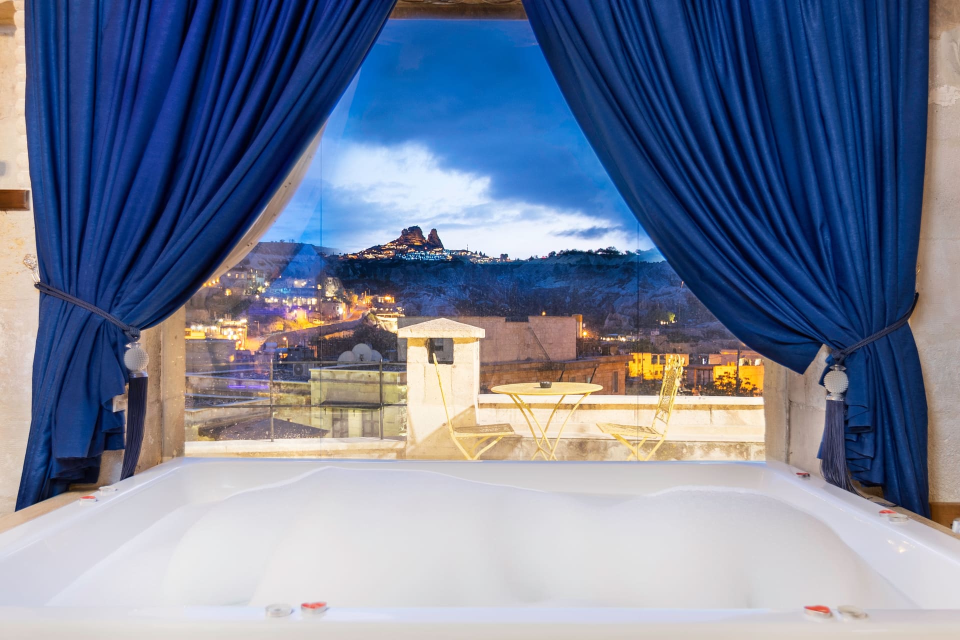 Room 120, Queen Suite: The jacuzzi tub against the night view, from another angle.