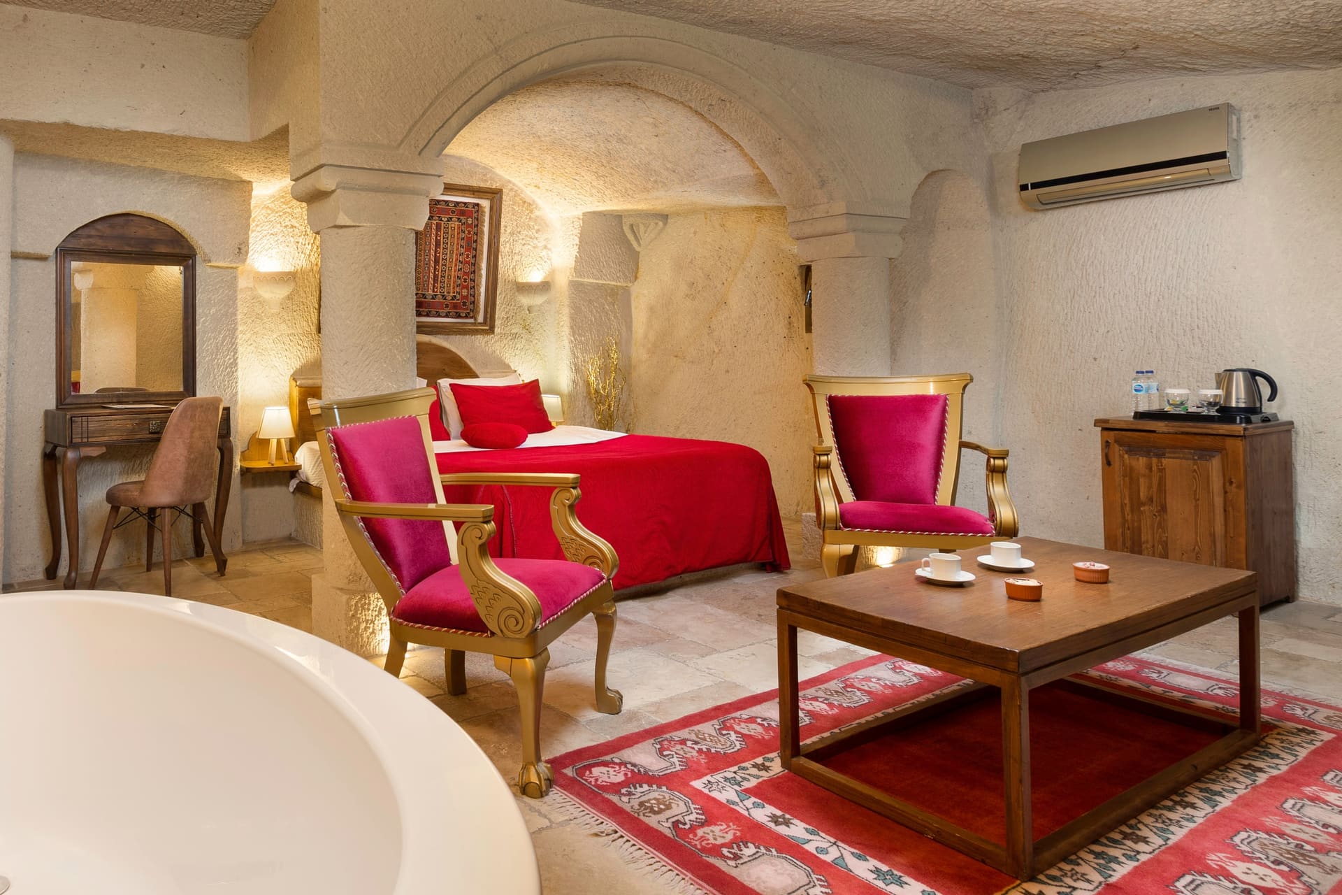 Room 115, Junior Cave Suite: bathtub, bed, wardrobe and mirror together in view