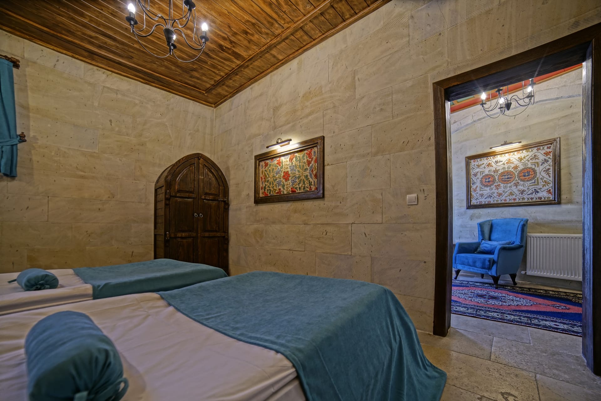 Room 119, Junior Suite: Two single beds, with the seating corner through the open door