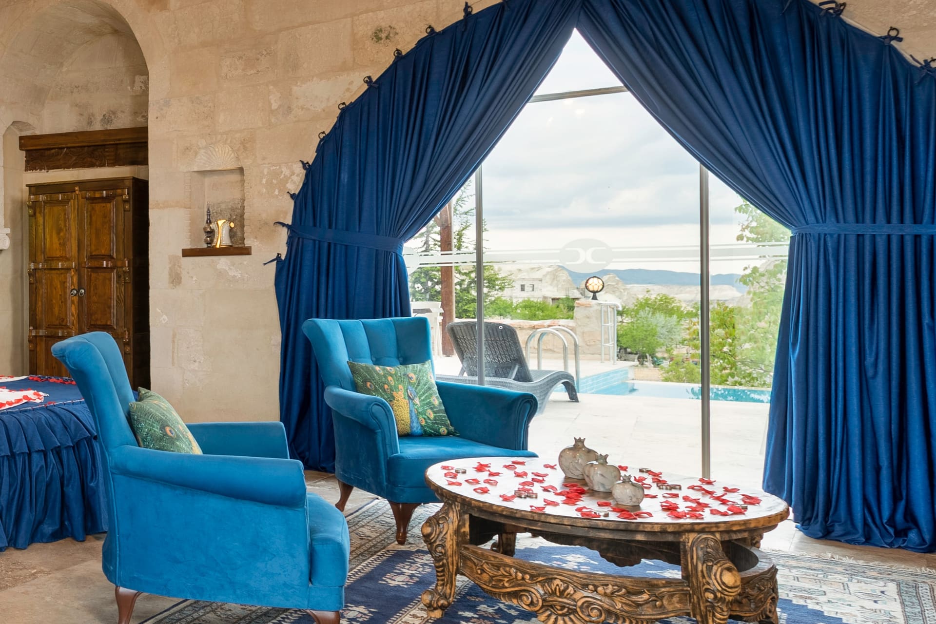 Room 120, Queen Suite: The sitting corner from another angle, the terrace visible through the curtain.