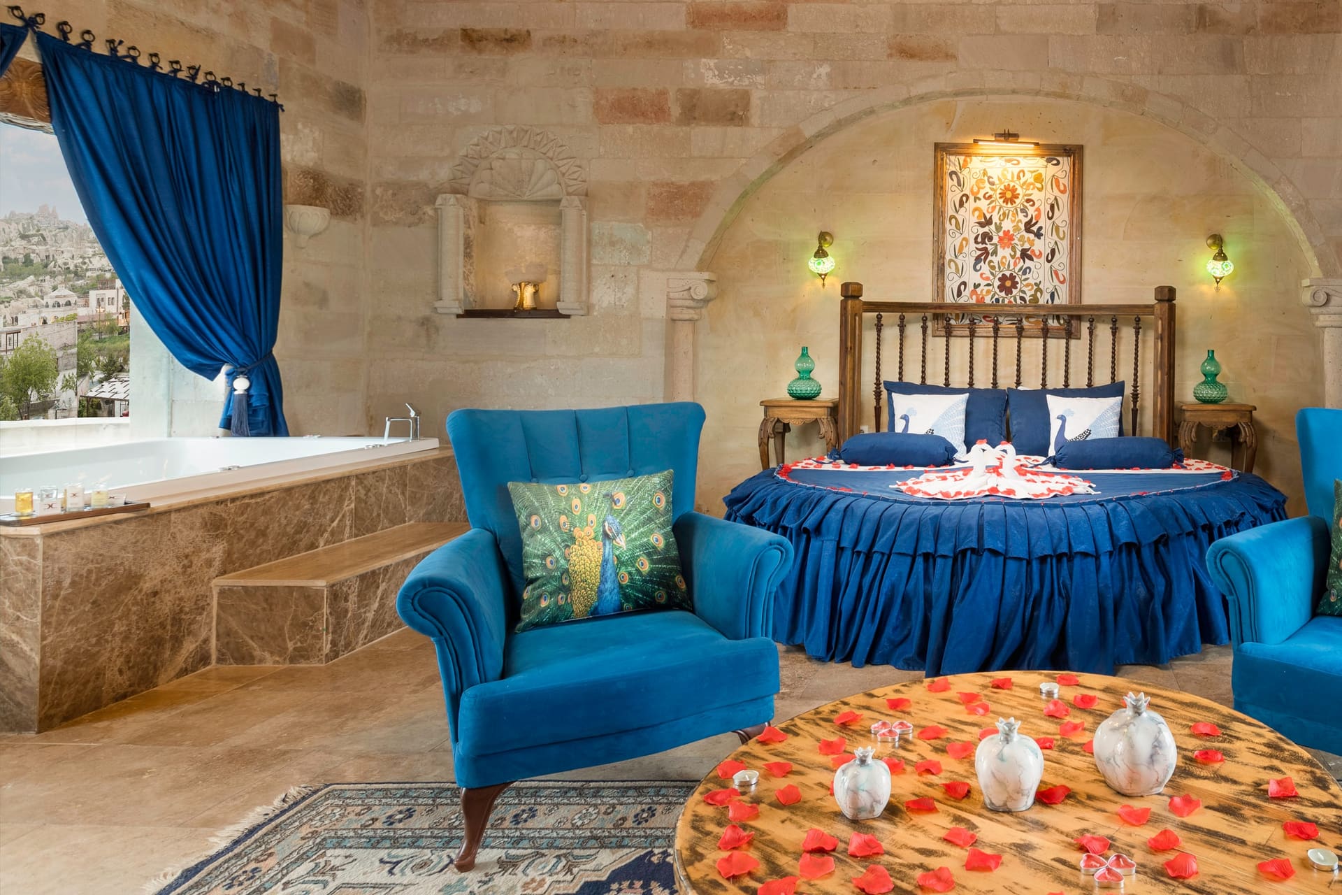 Room 120, Queen Suite: Seating corner with a coffee table, curtain open to the terrace.