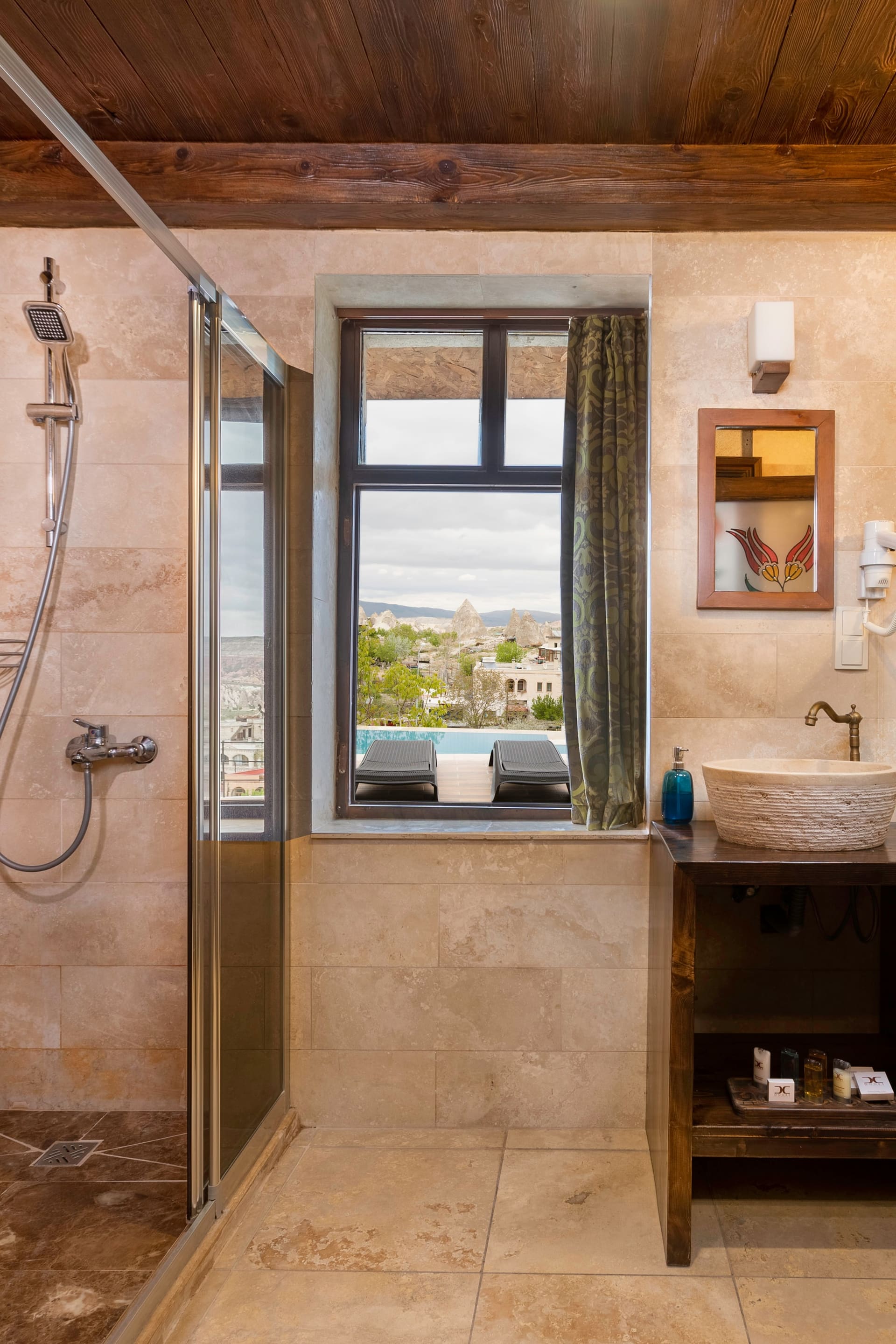Room 104, Junior Suite: Bathroom, shower, sink, mirror, window.
