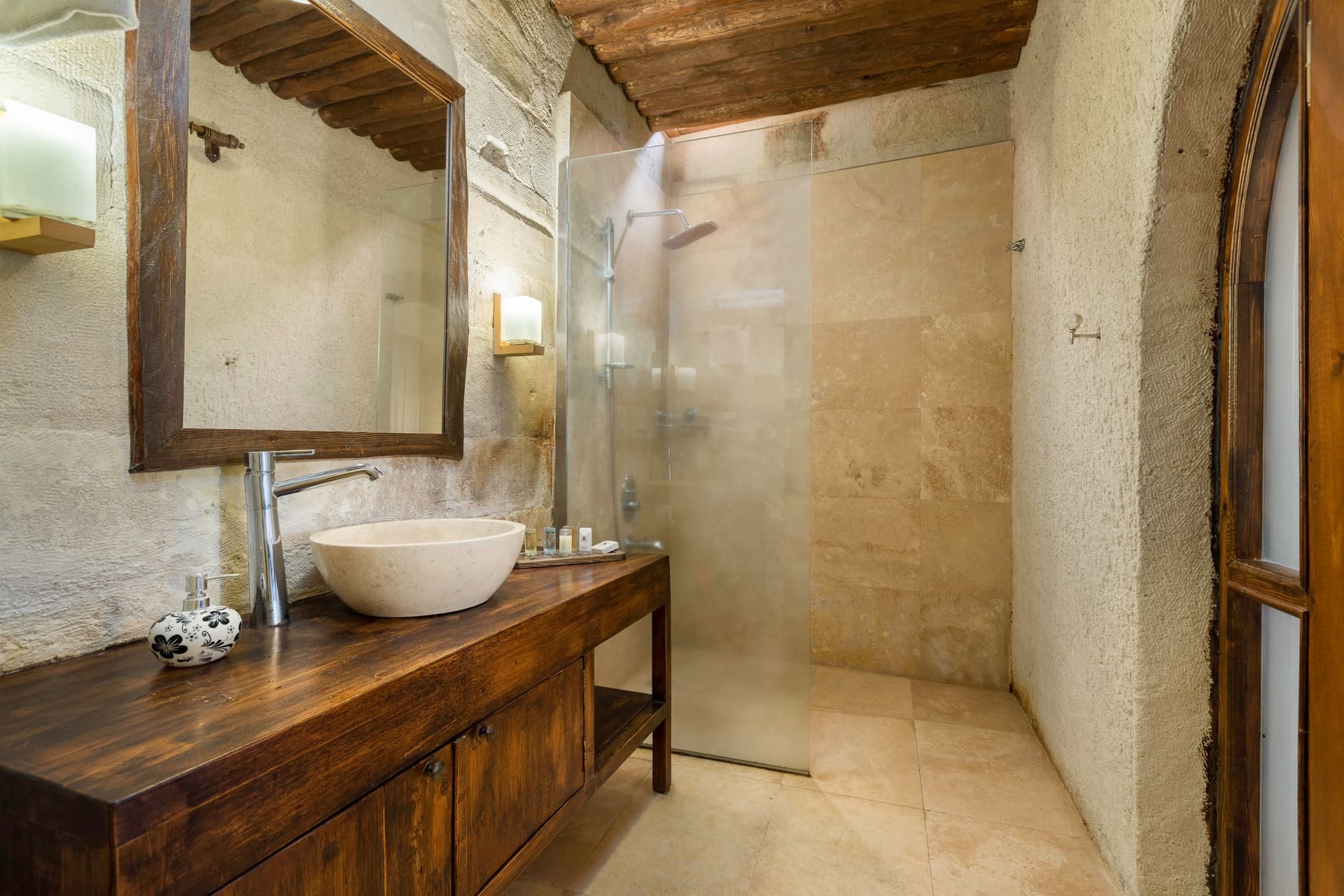 Room 102, Junior Suite: Bathroom, stone walls, vessel sink on wood counter, open shower area.