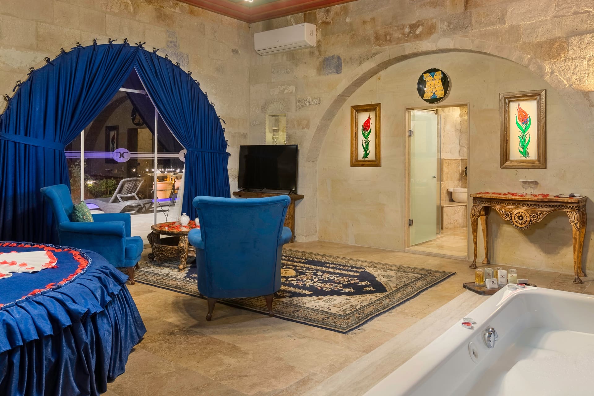Room 120, Queen Suite: Painted ceiling and the arched doorway leading to the bathroom.