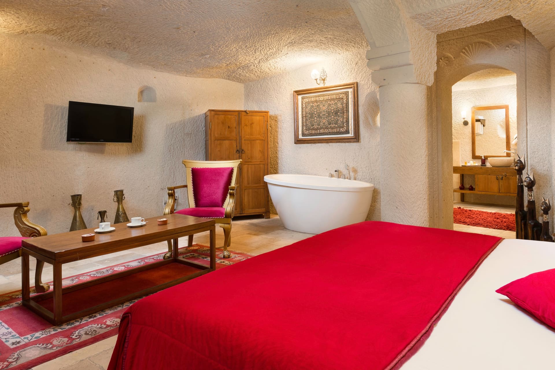 Room 115, Junior Cave Suite: the room from another angle, bed, bathtub, wardrobe, chairs