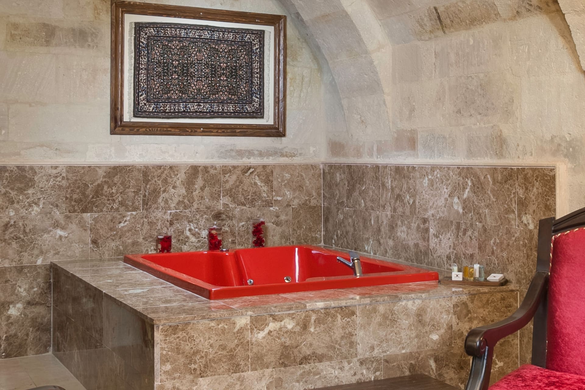 Room 110, Queen Suite: The jacuzzi tub from another angle, a framed picture on the wall.