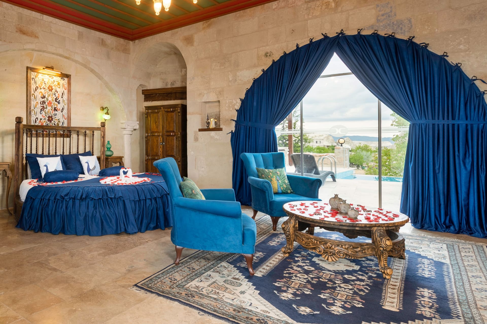 Room 120, Queen Suite: Sitting corner facing the terrace, decor pieces on the coffee table.