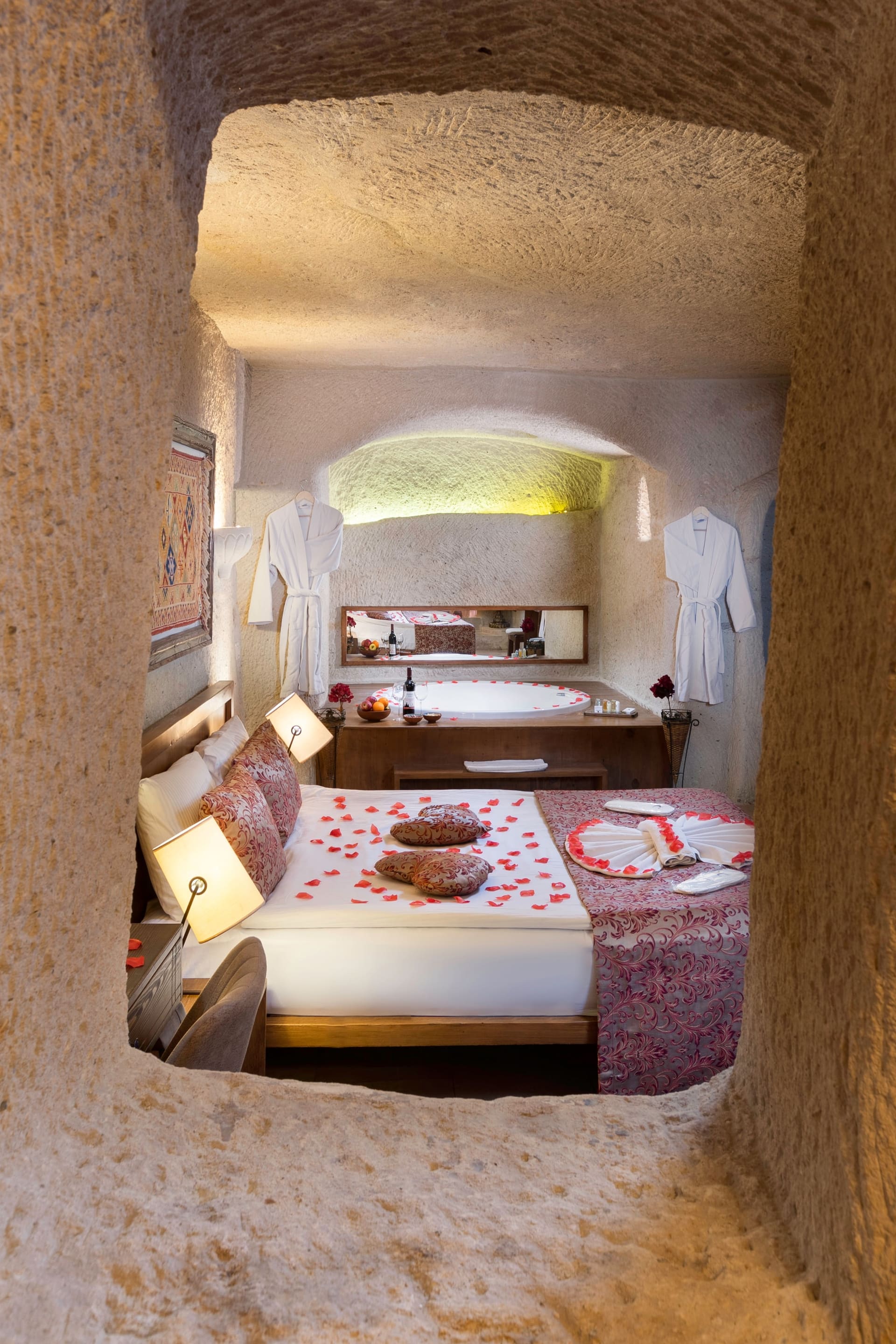 Room 111, King Cave Suite: a narrow stone window framing a partial view of the bedroom