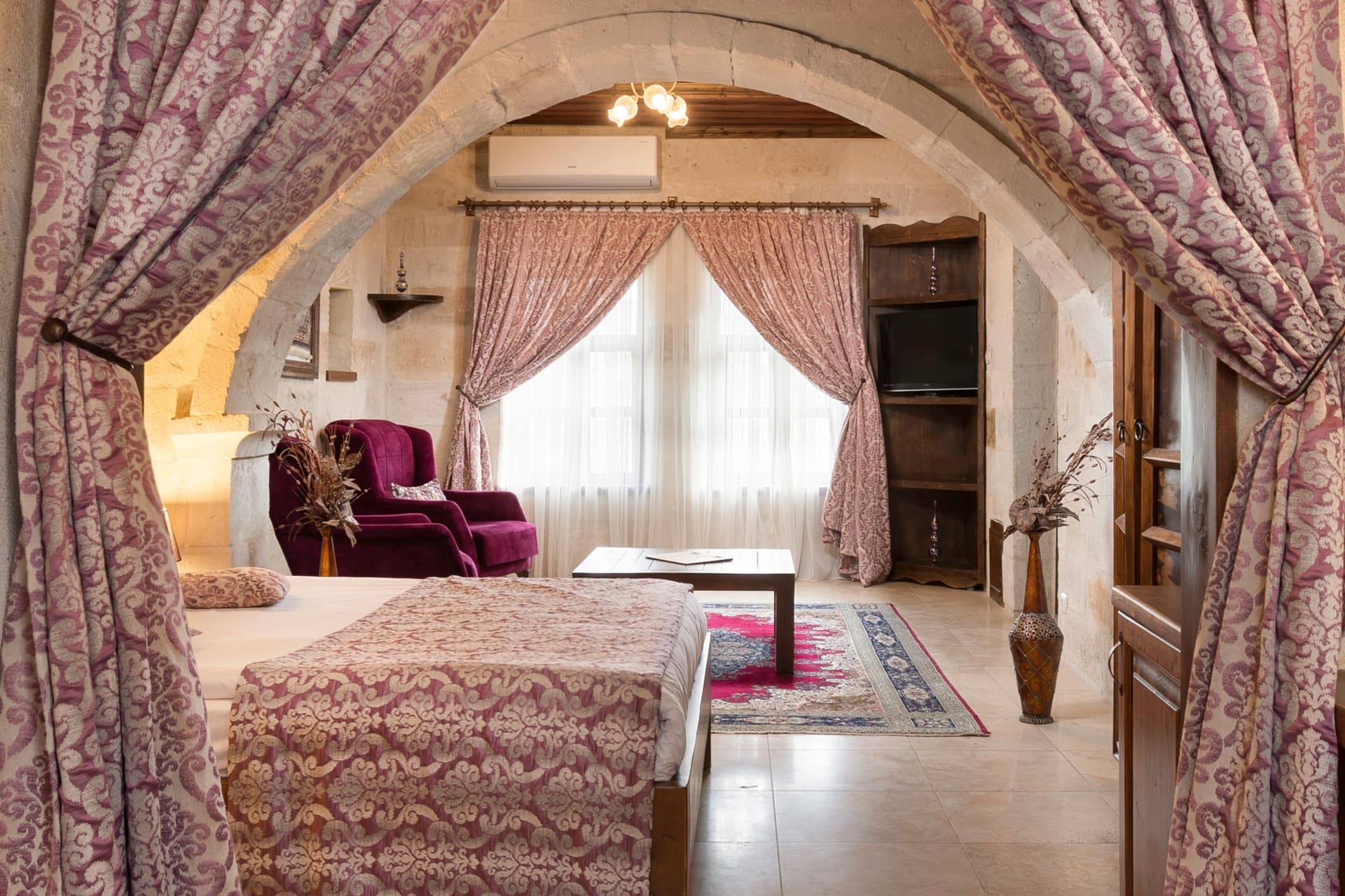 Room 105, King Suite: another angle through the arch looking toward the bed