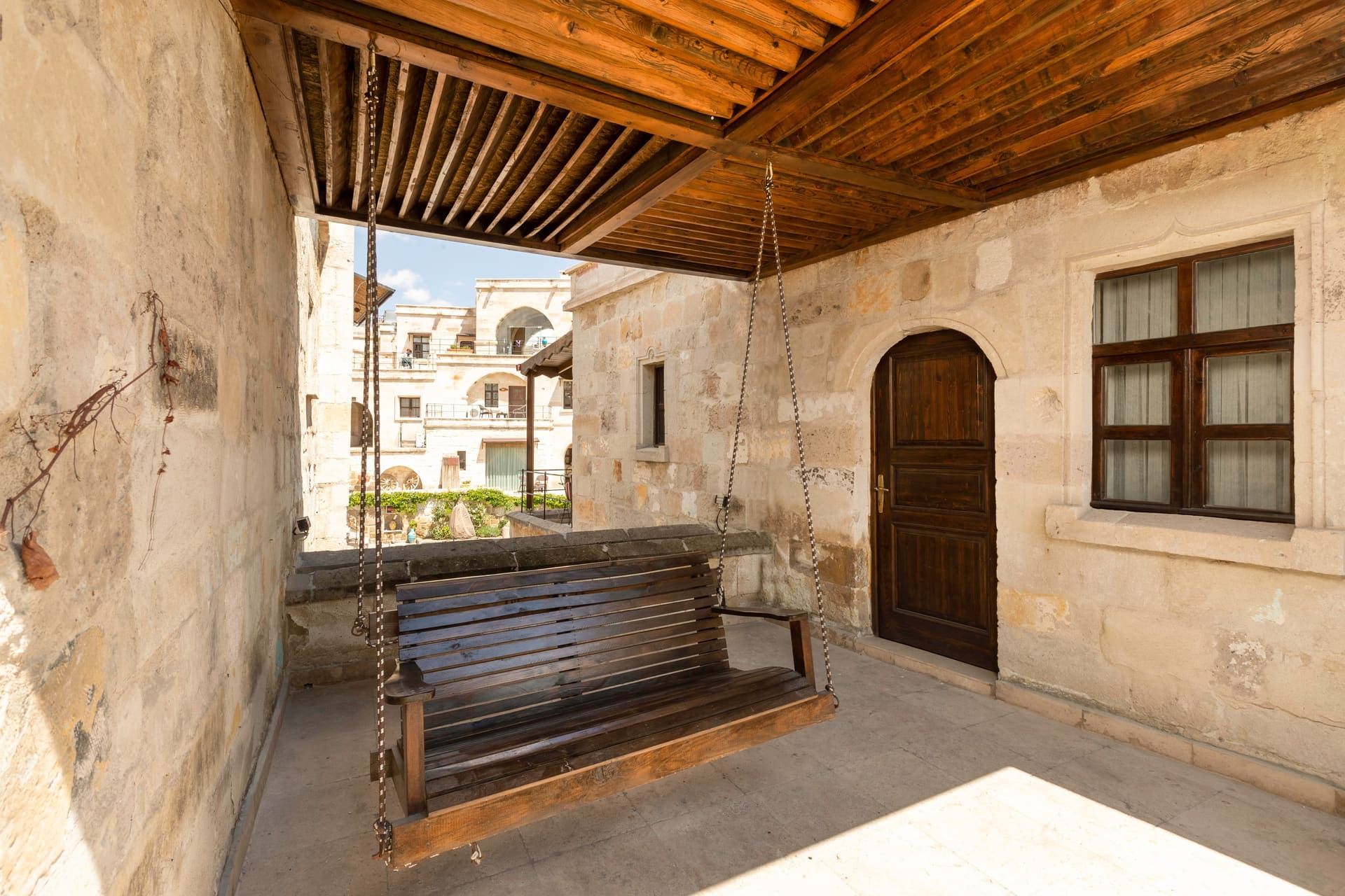 Room 118, Deluxe: Covered terrace, wooden porch swing, entrance door