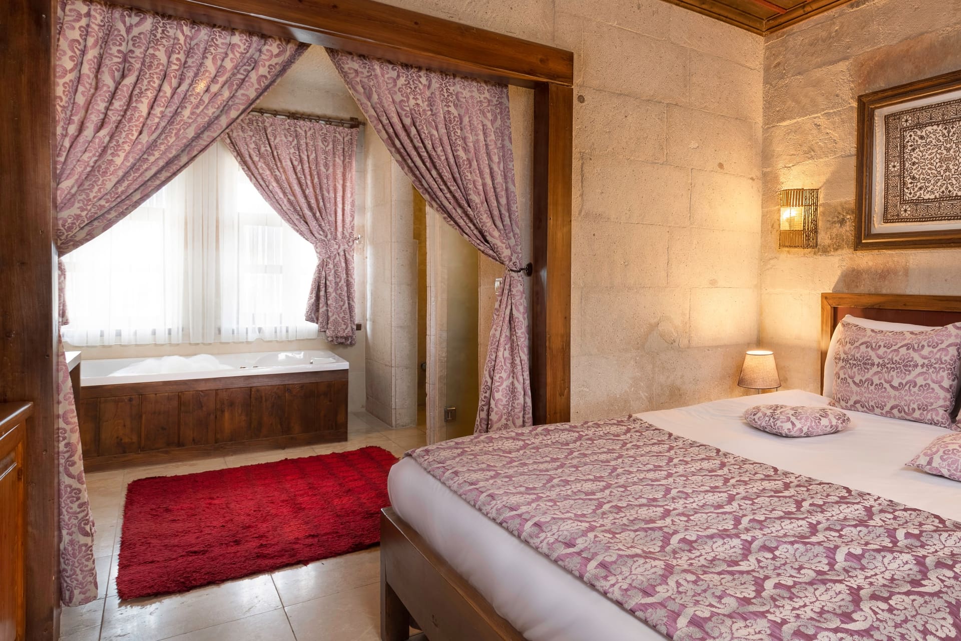 Room 105, King Suite: close view of the window and curtains from the corner of the bed