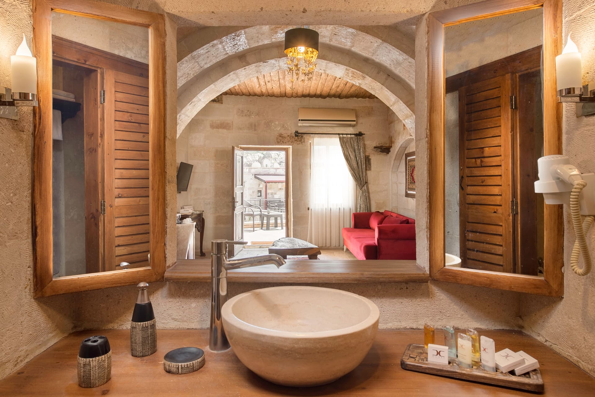 Room 108, Junior Suite: Bathroom, double mirror, vessel sink on counter, shuttered window.